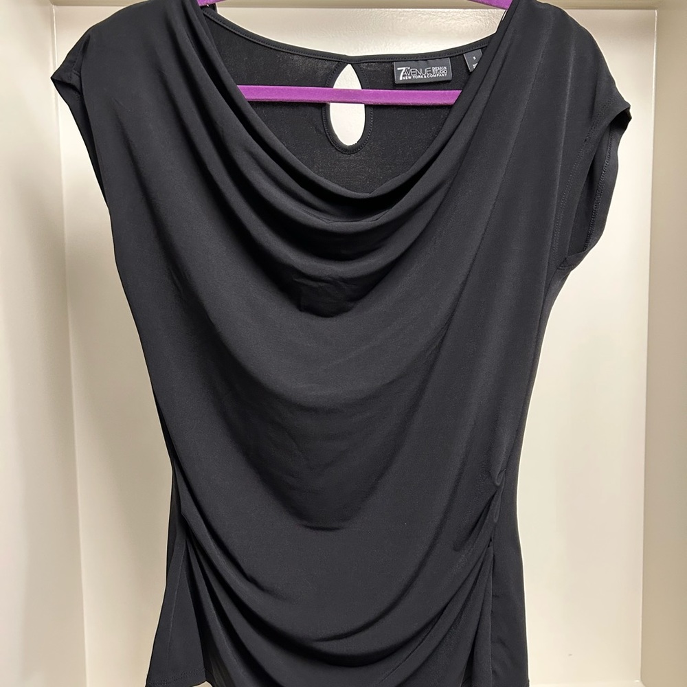 Woman’s dressy black top.